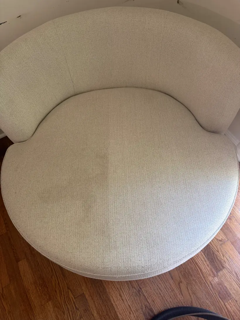 Round cream swivel accent armchair part-way through hot water extraction cleaning, Atlanta GA